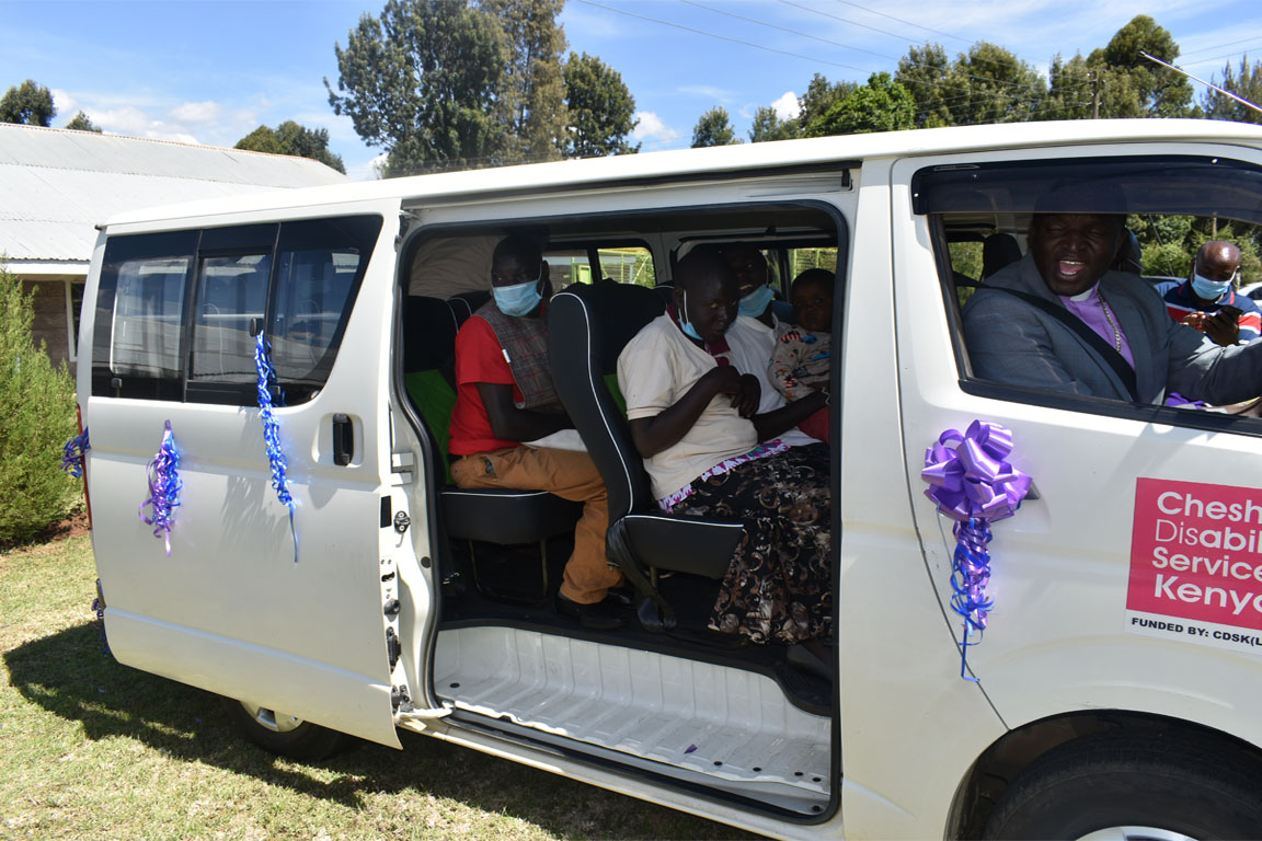 Caregivers & chldren with disabilities taking their first drive in the newly donated van.