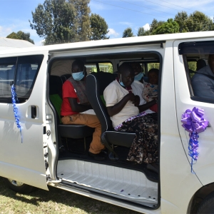 Caregivers & chldren with disabilities taking their first drive in the newly donated van.