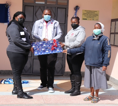 Cecilia Mutava receiving a gift from Naromoru Disabled Children’s Home Cecilia Mutava receiving a gift from Naromoru Disabled Children’s Home